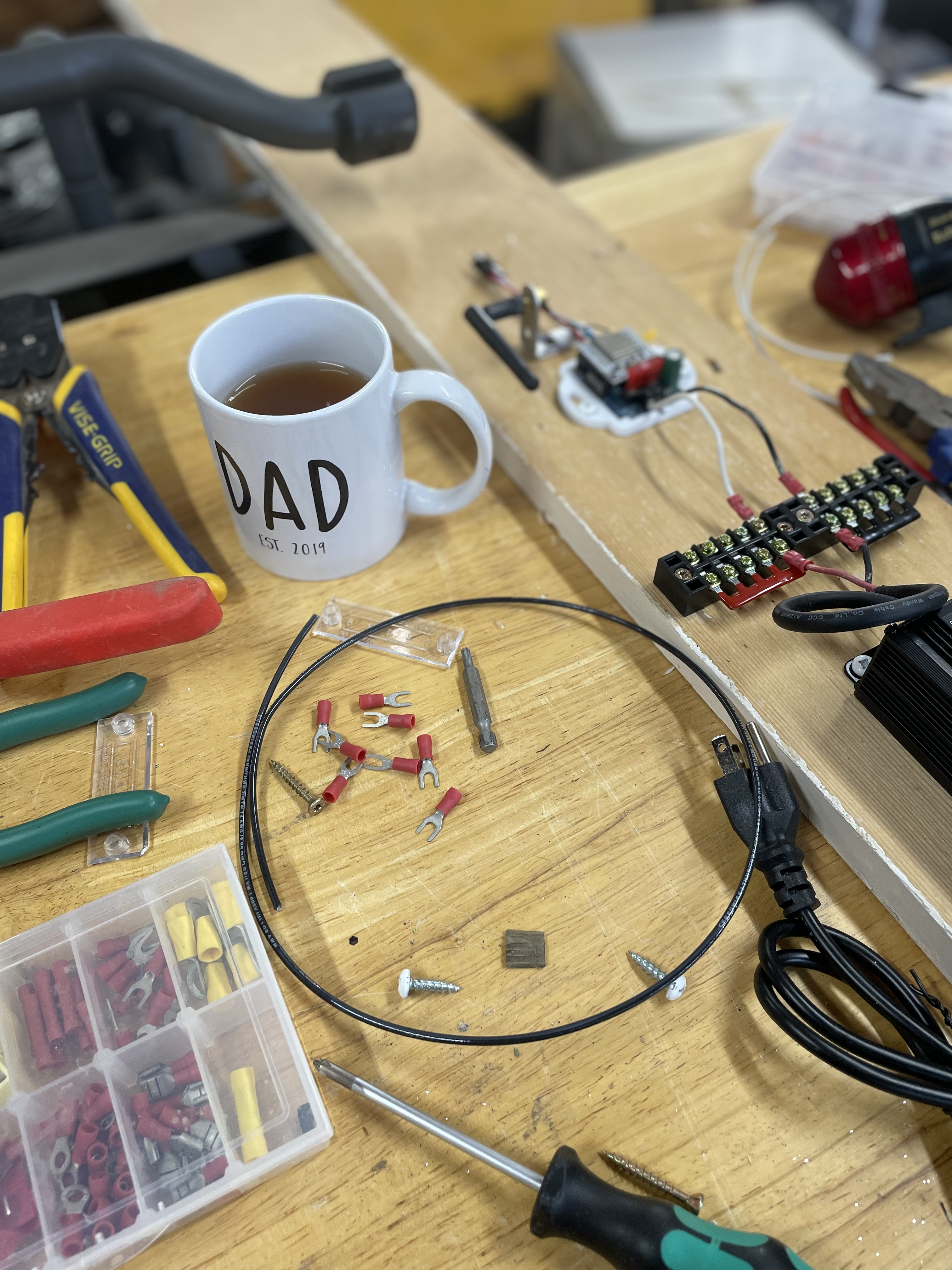 Mug of cider next to the garage lights project